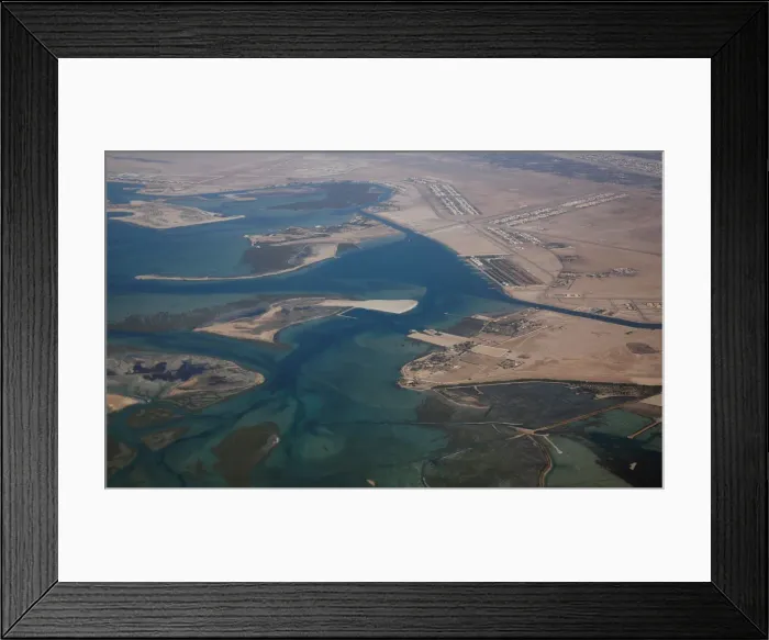 Framed Print : An aerial view of Arabian Gulf with city of Abu Dhabi is pictured through the window of Framed Print : An aerial view of Arabian Gulf with city of Abu Dhabi is pictured through the window of