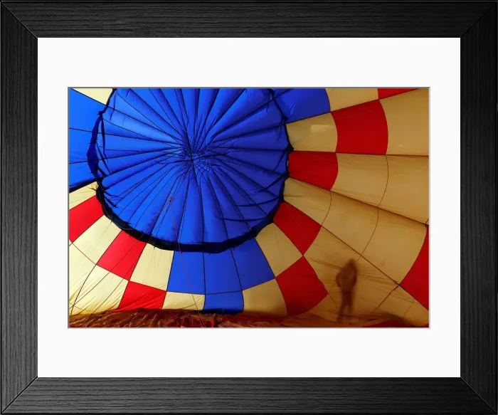 Framed Print : A Participant prepares a balloon for inflation during the International Hot Air Balloon Framed Print : A Participant prepares a balloon for inflation during the International Hot Air Balloon