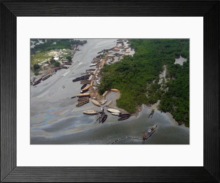Framed Print : An aerial view shows a shipyard on the oil-slicked waterways in the city of Port Harcourt