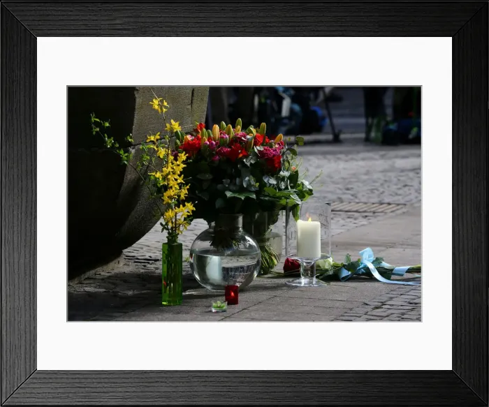 Framed Print : Flowers are seen on the site where on April 7 a man drove a van into a group of people Framed Print : Flowers are seen on the site where on April 7 a man drove a van into a group of people