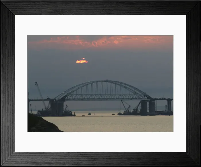 Framed Print : A general view shows a road-and-rail bridge, which is constructed to connect the Russian Framed Print : A general view shows a road-and-rail bridge, which is constructed to connect the Russian