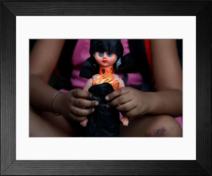 Framed Print : A child attends attend a protest against the rape of an eight-year-old girl, in Kathua Framed Print : A child attends attend a protest against the rape of an eight-year-old girl, in Kathua