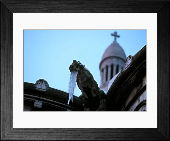 Framed Print : Icicles hang from a gargoyle on the Sacre Coeur basilica at the Butte Montmartre in Paris