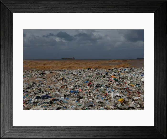 Framed Print : Garbage is seen at a shore in Zouk Mosbeh Framed Print : Garbage is seen at a shore in Zouk Mosbeh