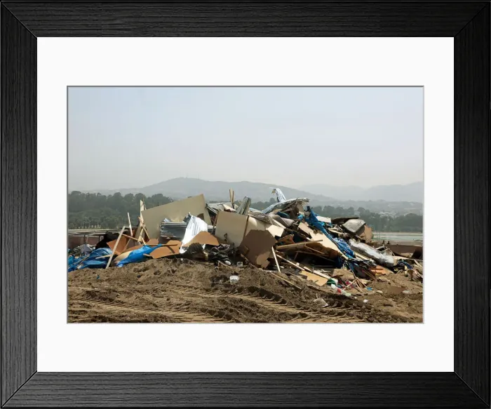 Framed Print : Debris of huts are seen after police evict squatters from a land in Villa El Salvador Framed Print : Debris of huts are seen after police evict squatters from a land in Villa El Salvador