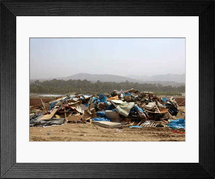 Framed Print : Debris of huts are seen after police evict squatters from a land in Villa El Salvador Framed Print : Debris of huts are seen after police evict squatters from a land in Villa El Salvador