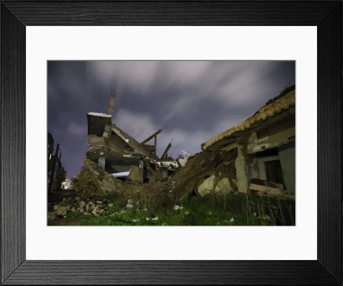 Framed Print : Damaged houses are pictured at night in the rebel-held area, in the city of Daraa, Syria Framed Print : Damaged houses are pictured at night in the rebel-held area, in the city of Daraa, Syria
