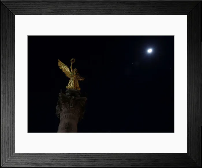 Framed Print : The Angel de la Independencia monument is pictured as lights are turned off during Framed Print : The Angel de la Independencia monument is pictured as lights are turned off during