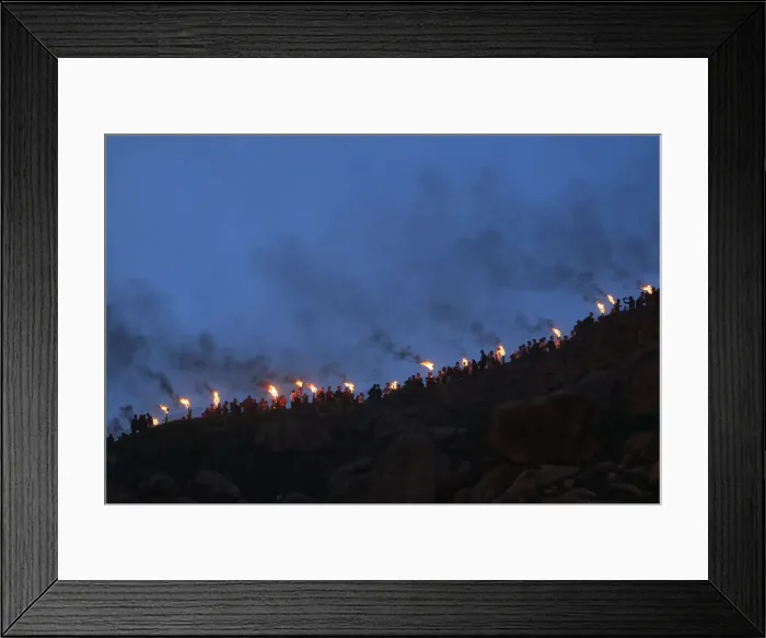 Framed Print : Iraqi Kurdish people carry fire torches up a mountain, as they celebrate Newroz Day Framed Print : Iraqi Kurdish people carry fire torches up a mountain, as they celebrate Newroz Day