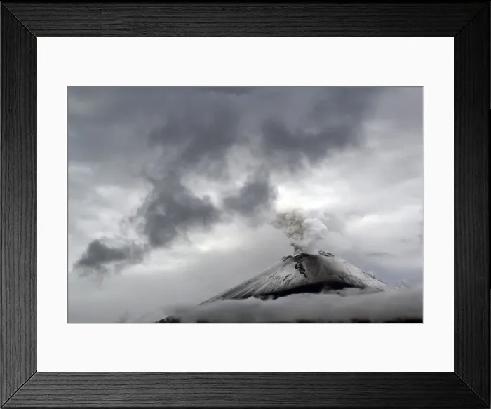 Framed Print : The snow-covered Popocatepetl volcano spews a cloud of steam high into the air in Puebla Framed Print : The snow-covered Popocatepetl volcano spews a cloud of steam high into the air in Puebla