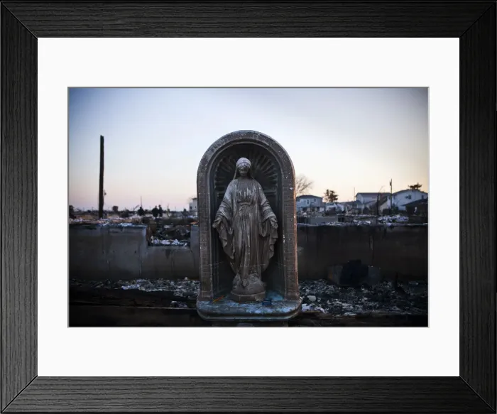 Framed Print : A Virgin Mary statue is seen amongst the rubble of a destroyed row of houses after Framed Print : A Virgin Mary statue is seen amongst the rubble of a destroyed row of houses after