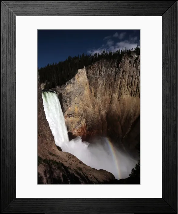 Framed Print : A rainbow of light is seen at the base of Yellowstone River Lower Falls in Yellowstone