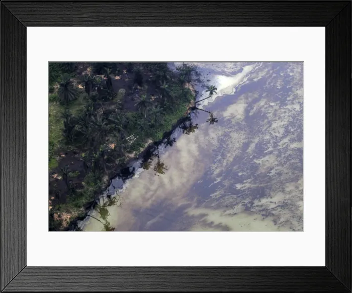 Framed Print : Oil surfaces on water near an illegal oil refinery in Ogoniland outside Port Harcourt in Framed Print : Oil surfaces on water near an illegal oil refinery in Ogoniland outside Port Harcourt in