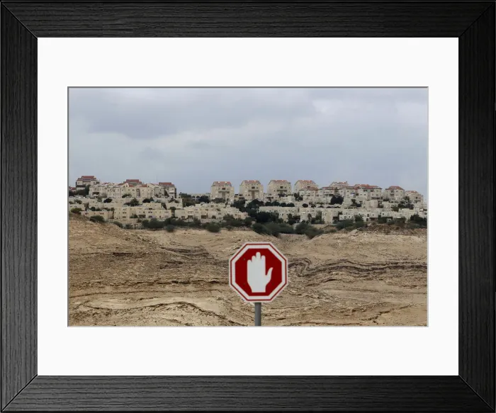 Framed Print : A stop sign is seen outside the Jewish settlement of Maale Adumim near Jerusalem