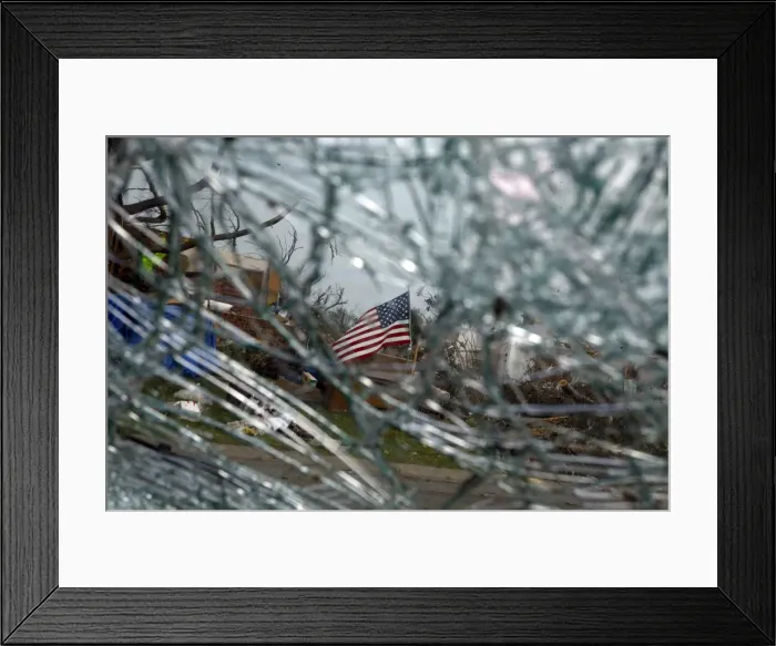 Framed Print : A U. S. flag is seen through a shattered car windshield in Joplin, Missouri Framed Print : A U. S. flag is seen through a shattered car windshield in Joplin, Missouri