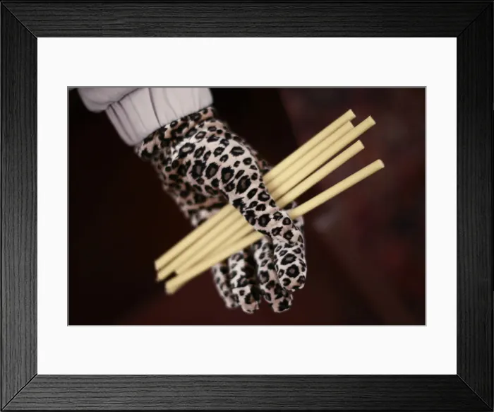 Framed Print : A Christian woman holds candles before a New Year mass at Saint Serkis church in central Framed Print : A Christian woman holds candles before a New Year mass at Saint Serkis church in central