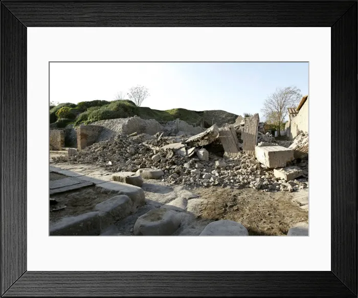 Framed Print : Debris is seen after a house, once used by gladiators to train before combat