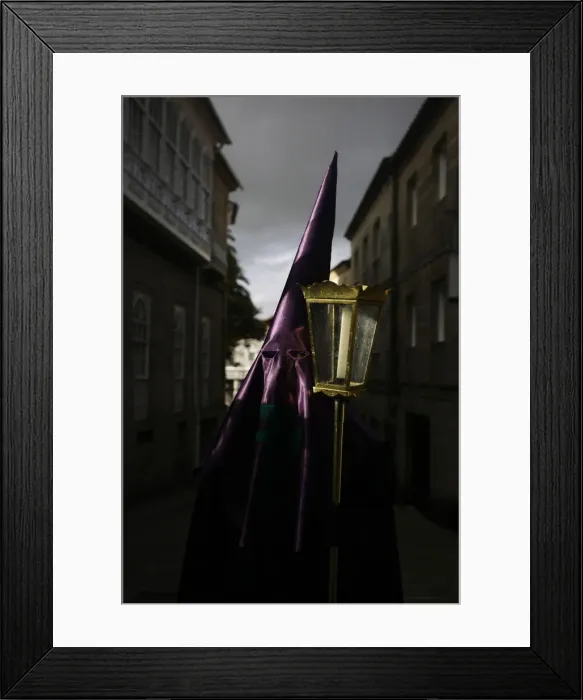 Framed Print : A penitent waits to start the procession of the Veracruz brotherhood during the Holy Framed Print : A penitent waits to start the procession of the Veracruz brotherhood during the Holy