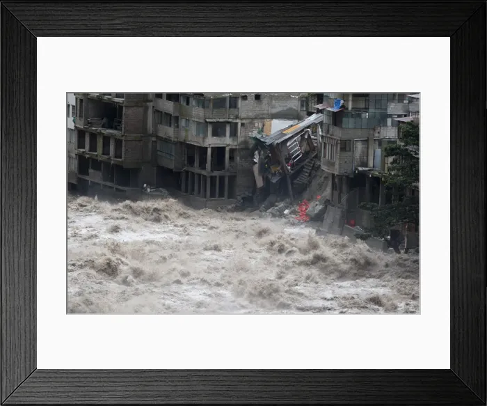 Framed Print : Damaged buildings, including hotels, are flooded by the Vilcanota river in Machu Picchu Framed Print : Damaged buildings, including hotels, are flooded by the Vilcanota river in Machu Picchu