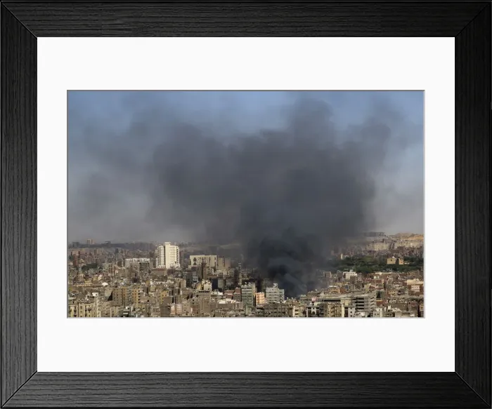 Framed Print : Smoke rises as a fire rages in central Cairo