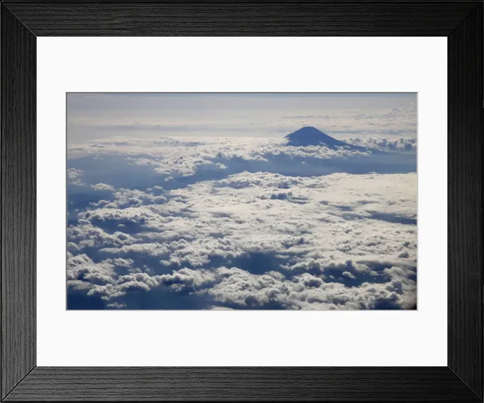 Framed Print : Japans Mount Fuji, surrounded by cloud, is seen from an airplane Framed Print : Japans Mount Fuji, surrounded by cloud, is seen from an airplane