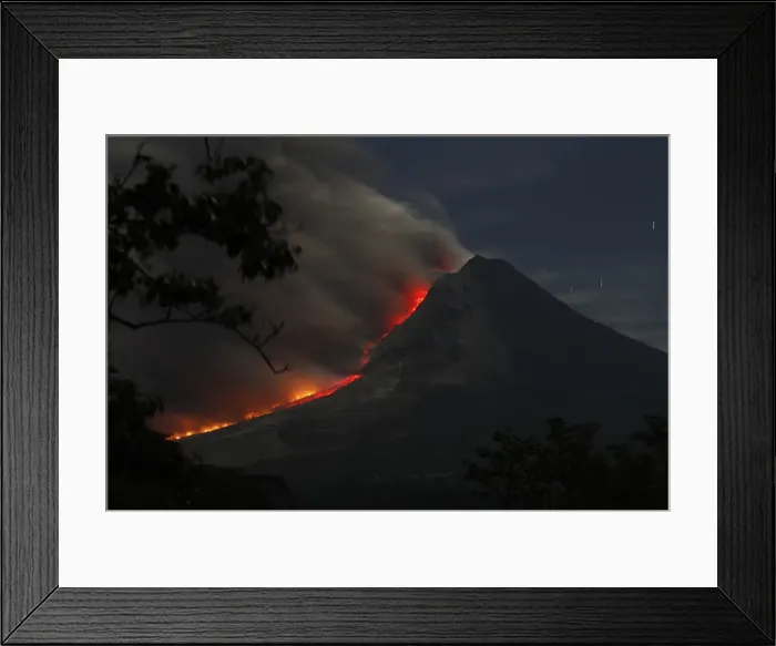 Framed Print : Mount Sinabung volcano spews ash as seen from Kuta Tengah village in Karo district Framed Print : Mount Sinabung volcano spews ash as seen from Kuta Tengah village in Karo district