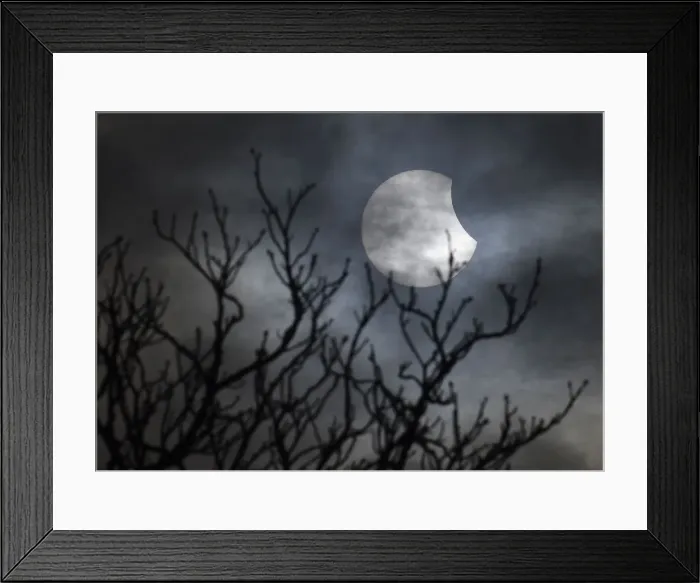 Framed Print : A partial solar eclipse is seen from near Bridgwater, in south western England Framed Print : A partial solar eclipse is seen from near Bridgwater, in south western England