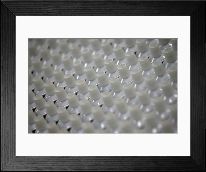 Framed Print : Toothpaste tubes are seen on the production line at the Unilever factory in Lagos