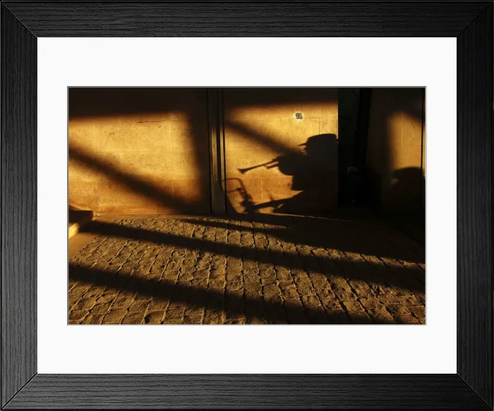 Framed Print : A street musician performs under a bridge in Paris Framed Print : A street musician performs under a bridge in Paris