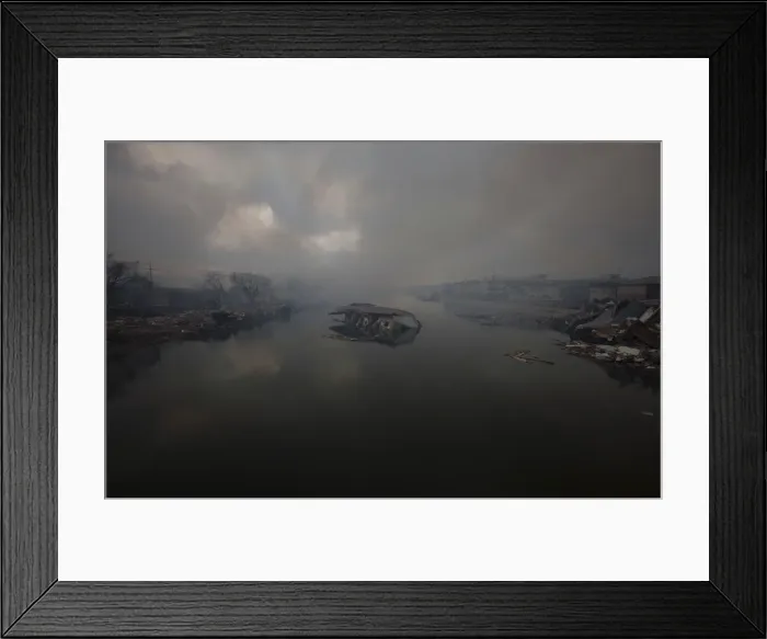 Framed Print : A house lies damaged in a river going through Kesennuma City days after the area was Framed Print : A house lies damaged in a river going through Kesennuma City days after the area was