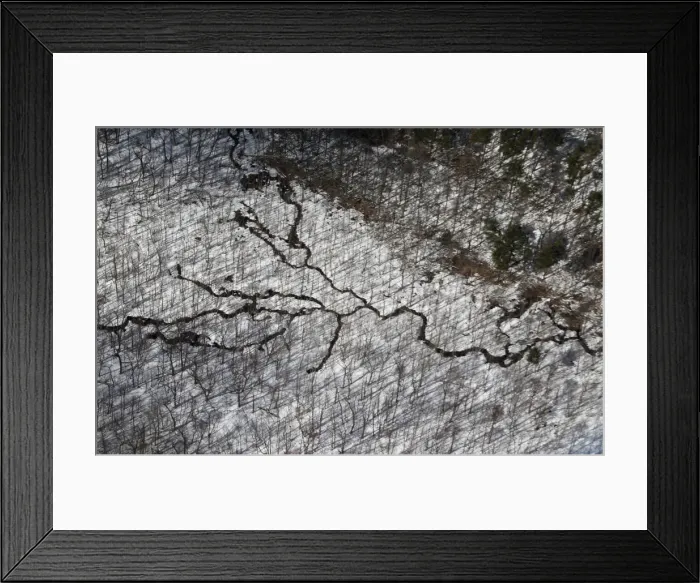 Framed Print : Cracks are seen on the snow-covered ground in woodlands near the earthquake Framed Print : Cracks are seen on the snow-covered ground in woodlands near the earthquake