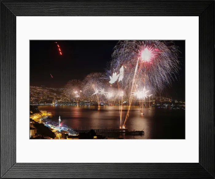 Framed Print : Fireworks explode during a pyrotechnic show to celebrate the new year in the coastal city Framed Print : Fireworks explode during a pyrotechnic show to celebrate the new year in the coastal city