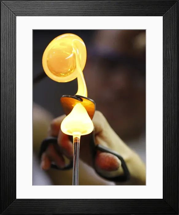 Framed Print : A worker of Riedel Glass company makes a wine glass in Kufstein Framed Print : A worker of Riedel Glass company makes a wine glass in Kufstein