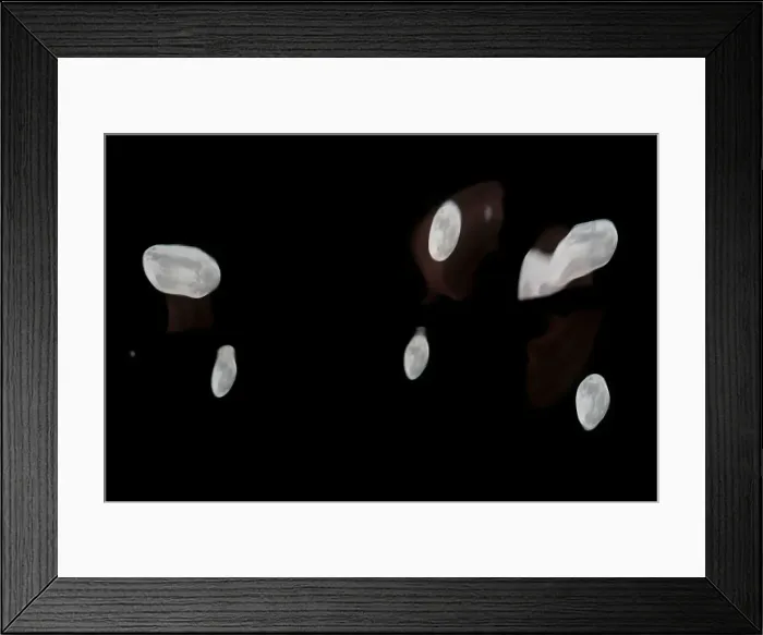 Framed Print : Supermoon full moon reflections are seen on the windows of a business building in Ronda