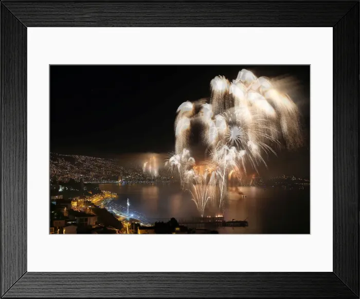 Framed Print : Fireworks explode during a pyrotechnic show to celebrate the new year in the coastal city Framed Print : Fireworks explode during a pyrotechnic show to celebrate the new year in the coastal city
