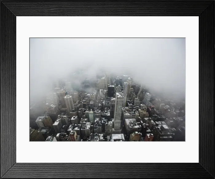 Framed Print : Low lying clouds from a snowstorm obscure the skyline of New York Framed Print : Low lying clouds from a snowstorm obscure the skyline of New York