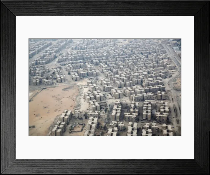 Framed Print : An aerial view of new housing complexes in a suburb of Cairo is pictured through Framed Print : An aerial view of new housing complexes in a suburb of Cairo is pictured through