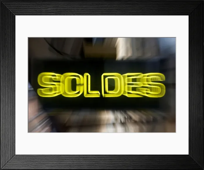 Framed Print : A sign announces Sales at a general store front window during the start of winter sales Framed Print : A sign announces Sales at a general store front window during the start of winter sales