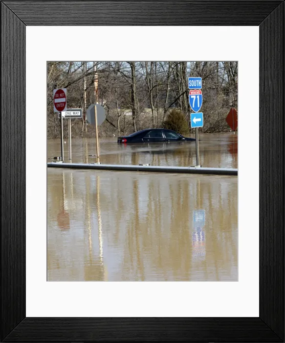 Framed Print : A car is submerged in water that covers the off ramp of interstate 71 along the Ohio Framed Print : A car is submerged in water that covers the off ramp of interstate 71 along the Ohio