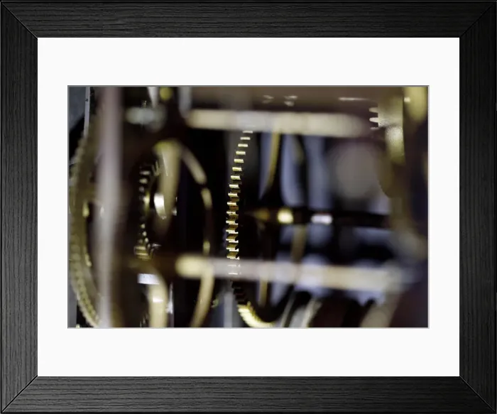 Framed Print : Gear wheels of a wall clock are pictured in a watchmakers shop in Bordeaux Framed Print : Gear wheels of a wall clock are pictured in a watchmakers shop in Bordeaux