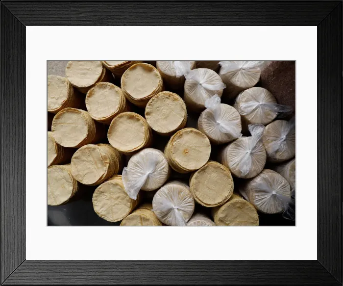 Framed Print : Stacks of freshly made corn tortillas are seen at a tortilla a factory in Mexico City
