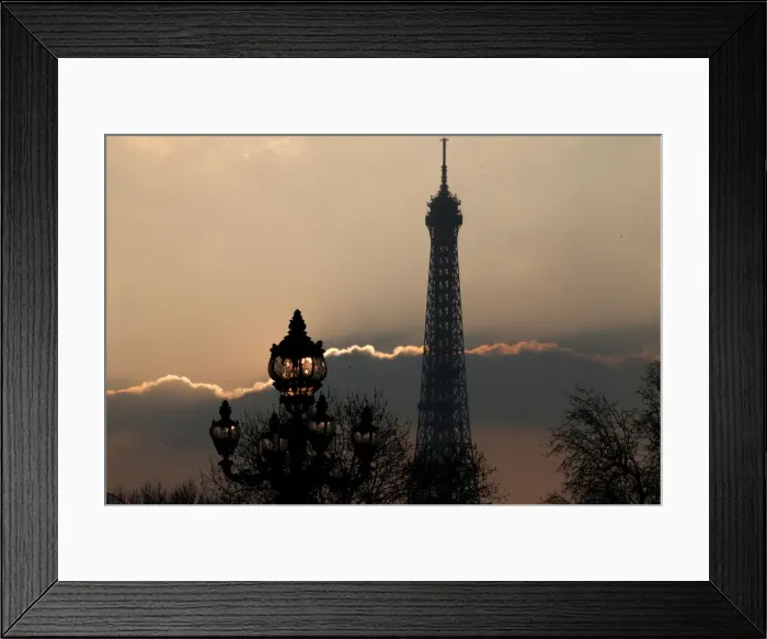 Framed Print : The Eiffel tower is pictured as the sun sets on a winter day in Paris Framed Print : The Eiffel tower is pictured as the sun sets on a winter day in Paris