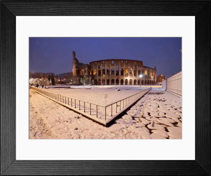Framed Print : The ancient Colosseum is seen during a heavy snowfall early in the morning in Rome Framed Print : The ancient Colosseum is seen during a heavy snowfall early in the morning in Rome