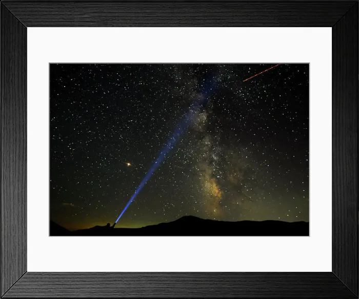 Framed Print : A man points his light at the Milky Way during the peak of the Perseid meteor shower in Framed Print : A man points his light at the Milky Way during the peak of the Perseid meteor shower in