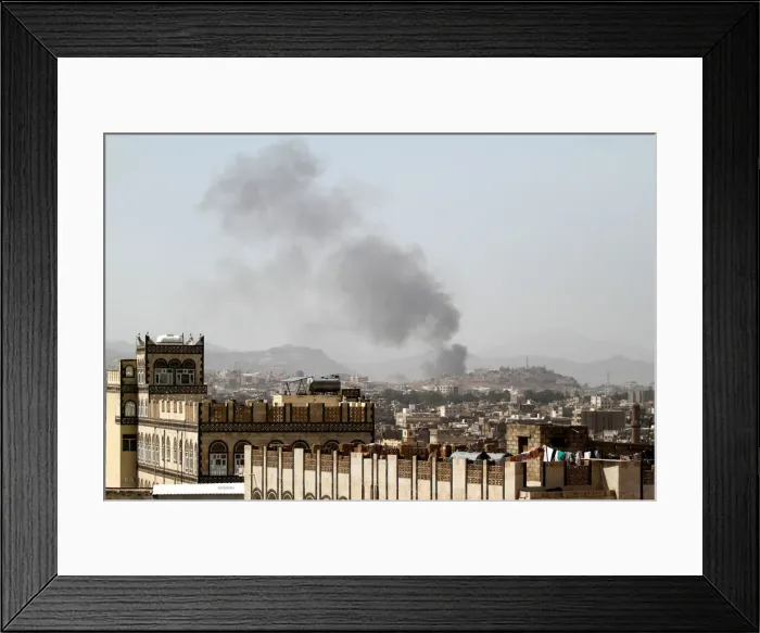 Framed Print : Smoke rises after an airstrike in Sanaa Framed Print : Smoke rises after an airstrike in Sanaa