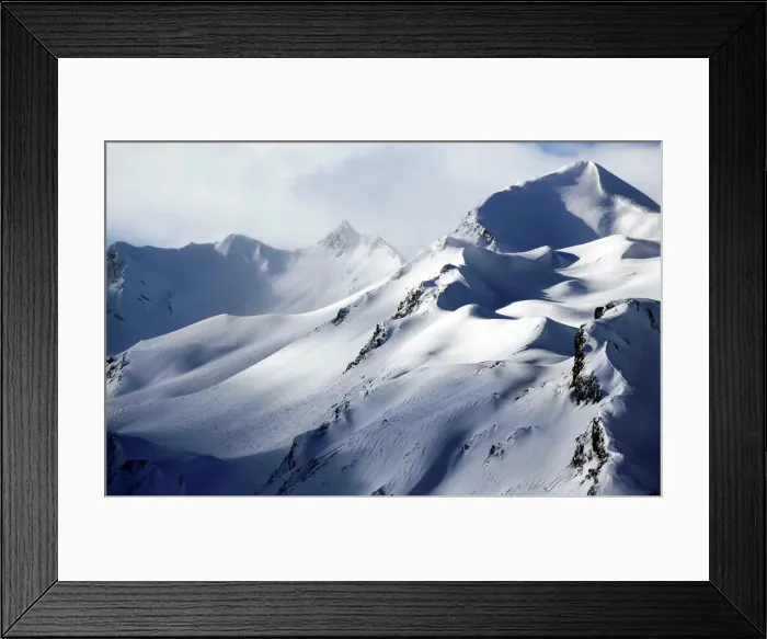 Framed Print : Wind blows snow off the top of a mountain in Saint-Pancrace as winter weather bringing Framed Print : Wind blows snow off the top of a mountain in Saint-Pancrace as winter weather bringing