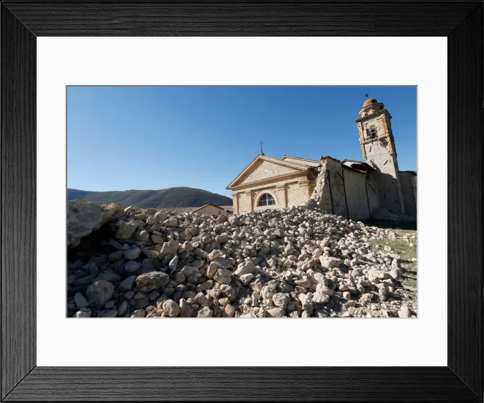Framed Print : Saint Anthony church is seen partially collapsed following an earthquake along the road Framed Print : Saint Anthony church is seen partially collapsed following an earthquake along the road
