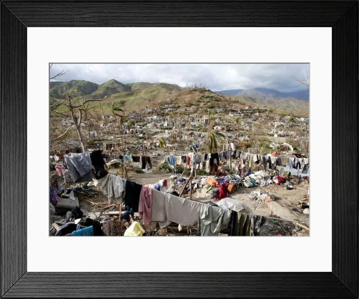 Framed Print : Clothes hang in an area destroyed by Hurricane Matthew in Les Anglais, Haiti Framed Print : Clothes hang in an area destroyed by Hurricane Matthew in Les Anglais, Haiti