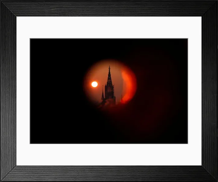 Framed Print : The sun rises behind the Muenster Cathedral during a cold morning in Bern Framed Print : The sun rises behind the Muenster Cathedral during a cold morning in Bern