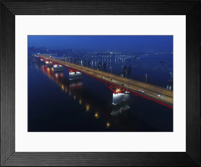Framed Print : An aerial view shows the illuminated Nikolaevsky highway bridge